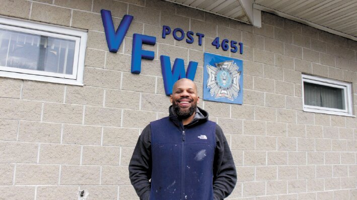 HE AIMS TO KEEP THE DOORS OPEN: Garry Crum standing in front of VFW Post 4651 located on 7 Haven Avenue. (Photo by Raymond Baccari)