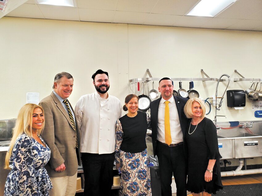WITH THE CHEF:  Gathering for a photo with WACTC culinary arts program Chef Austin Irons are School Committee member Leah Hazelwood, Assistant Superintendent William McCaffrey, RI Commissioner of Education Ang&eacute;lica Infante-Green, School Committee chair Shaun Galligan and Warwick Superintendent Lynn Dambruch. (Warwick Beacon photos by Kevin Fitzpatrick)