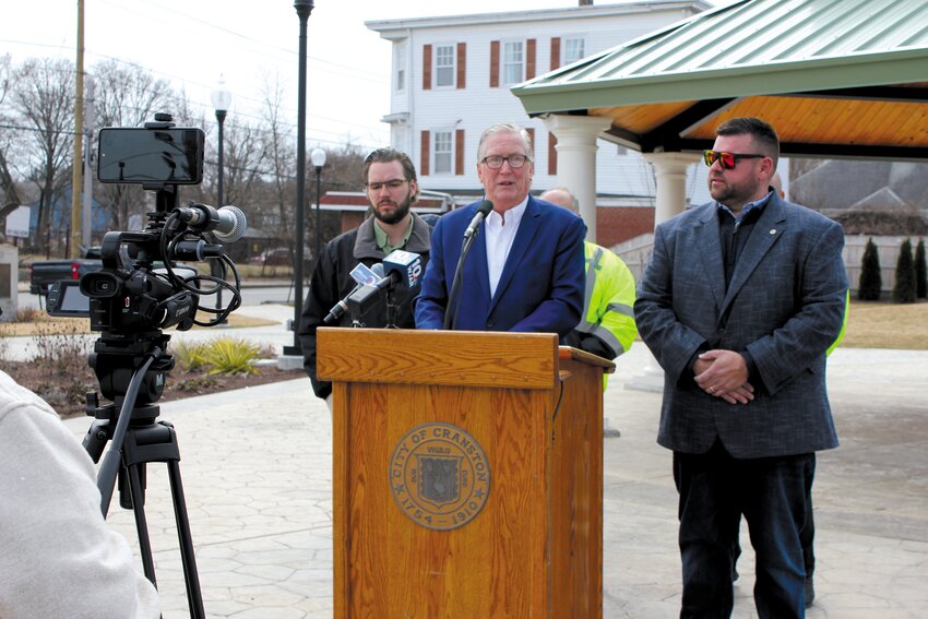 PHASE TWO BEGINS: Mayor Kenneth Hopkins speaks to the press from Itri Park about the next chapter of Knightsville’s revitalization. (Photo provided by Cranston City Hall)