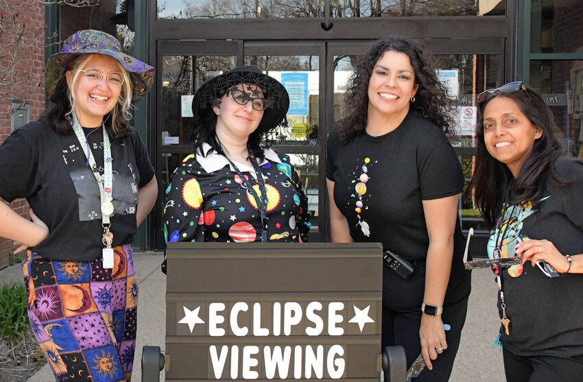 OUT OF THIS WORLD: Planetary was the wardrobe theme for West Warwick Library staff. (Photo by Barbara Polichetti)