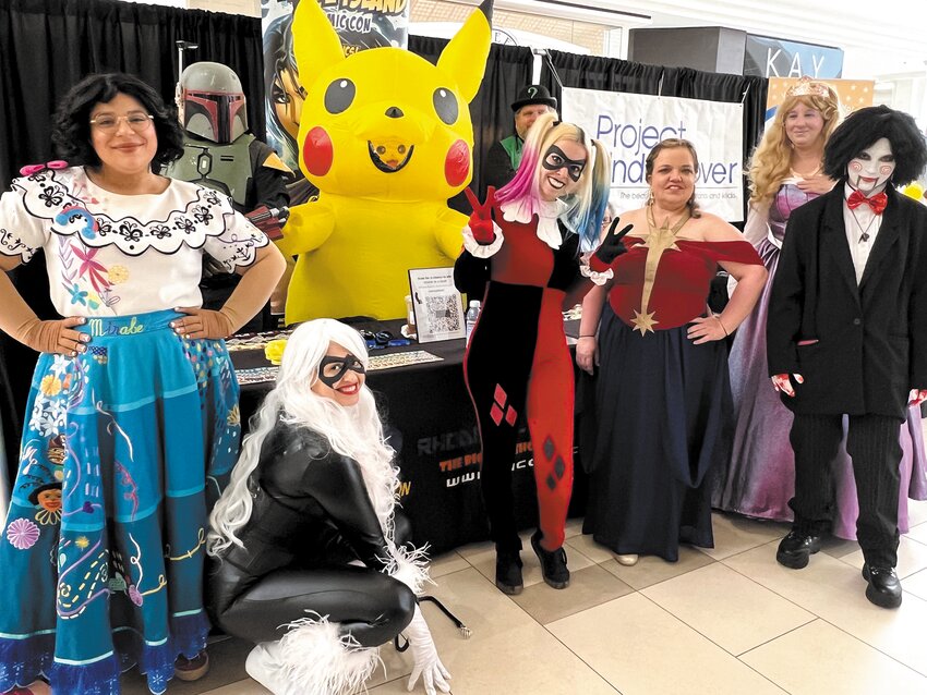 COLORFUL: In addition to bakery sweets for sale, glitter tattoos, and other handouts expo visitors got the chance to interact with some of their favorite Rhode Island Comic Con characters. (Warwick Beacon photo by Barbara Polichetti)