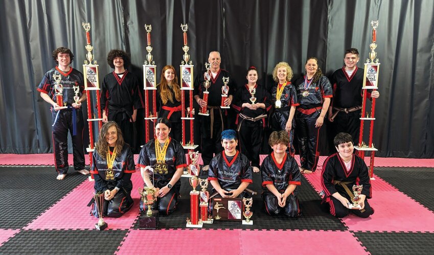 TAKING HOME SOME HARDWARE: Members of the Don Rodrigues Karate Academy show off the trophies they won at the recent Ocean State Grand National Karate Championships. (Submitted photo)