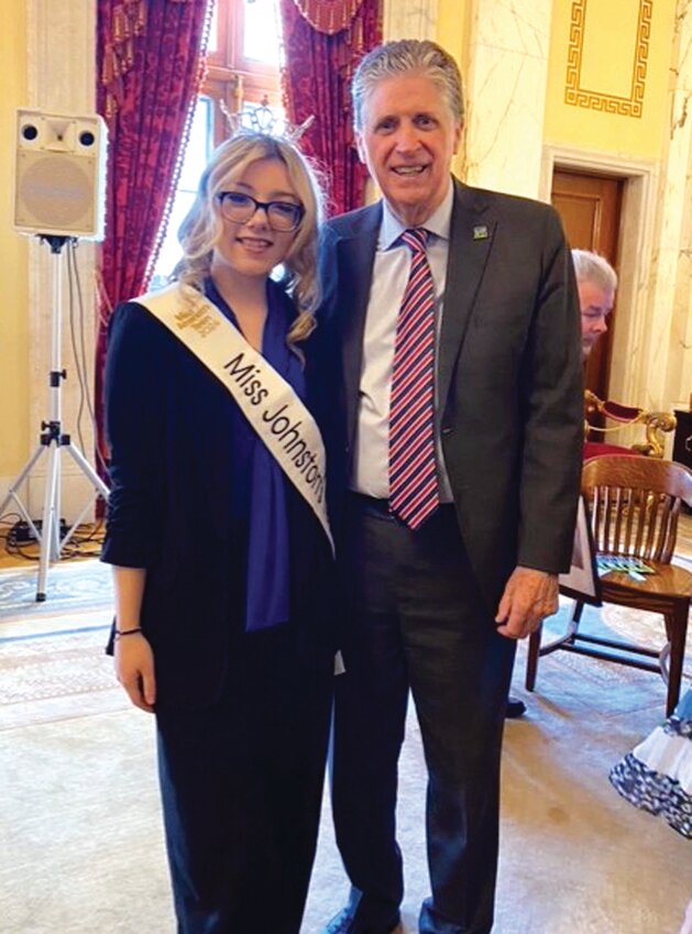 BUSY SCHEDULE: Rayna DiGiacomo takes a photo with Gov. Dan McKee as she gets ready to compete in the Miss Rhode Island’s Teen event. (Submitted photos)