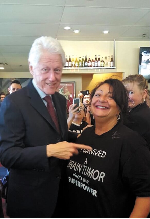 SEAL OF APPROVAL: Former president Bill Clinton points at Caprio&rsquo;s shirt, which says &ldquo;I survived a brain tumor. What&rsquo;s your superpower?&rdquo;