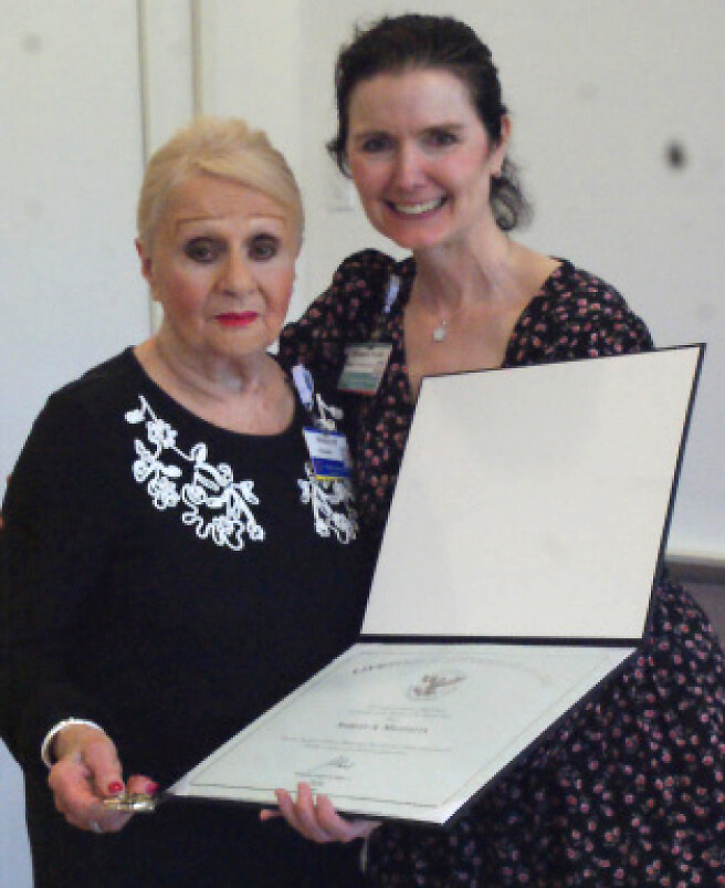 Shirley Mazzetta (left) and Adrianne Walsh manager of volunteer services at RI Hospital presenting Presidential Achievement Award. (Photo by Steve Popiel)