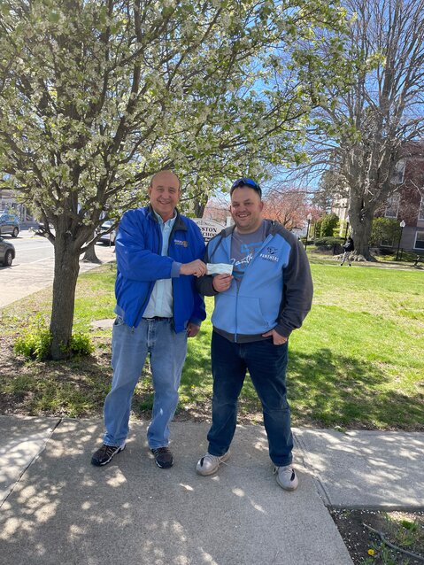 IT&rsquo;S ALL ABOUT CARING: Cezar Ferreria accepts a donation check of $222 from Cranston Cares President, Justin Erickson for the Friends of the Cranston Animal Shelter. (Cranston Herald photo)