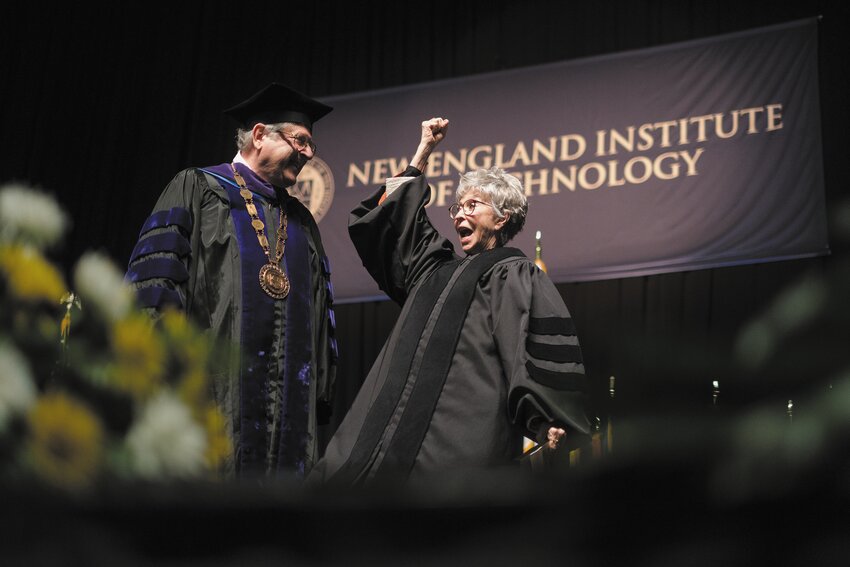 WHAT A PERFORMANCE: NEIT President Richard Gouse shares the moment with actress Rita Moreno at commencement Sunday at the Amica Mutual Pavilion in Providence. Moreno, 92, urged the graduates to never give up in her address. (Beacon Communications photos by Will Steinfeld)