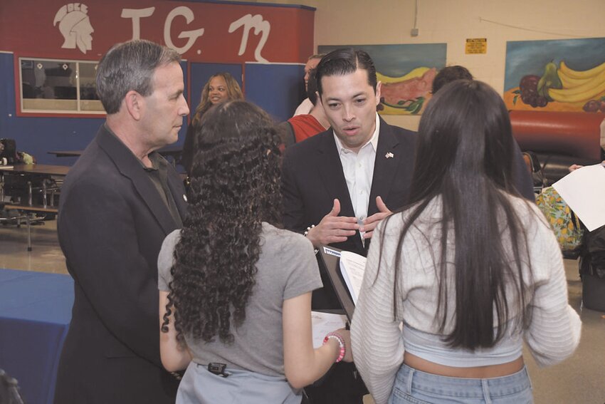 WHY IT COUNTS: Mayor Frank Picozzi and General Treasurer James Diossa discuss the importance of building a secure financial future with students at the Fair. (Submitted photos)