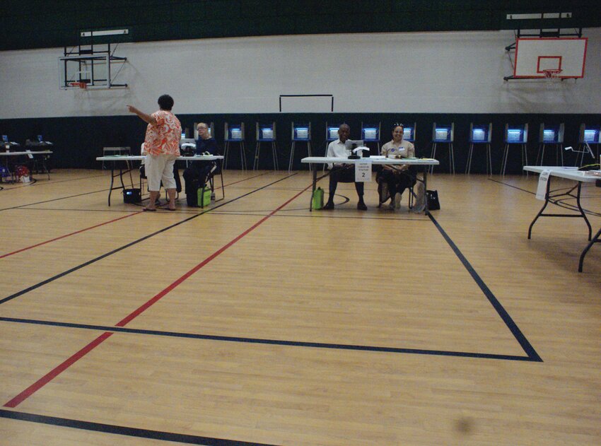 TO THE POLLS: Early Tuesday morning, June 4, after the polls opened, according to poll workers, there was a brief rush and then mostly quiet at the Ward 3 polling place inside the Peter T. Pastore Jr. Youth Center, at 155 Gansett Ave.