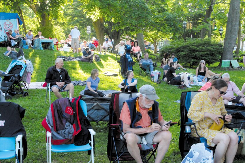 BALCONY SEATS: The embankment of Pawtuxet Park provided an overview of Saturday&rsquo;s events and a good place to catch the last rays of a perfect day.