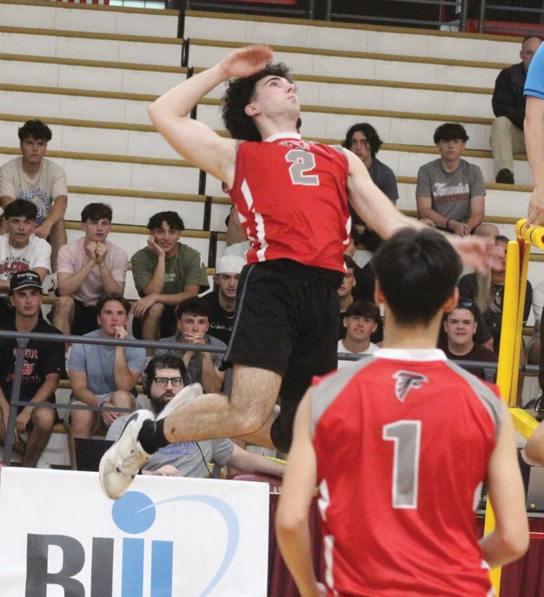 GOING UP: West senior Jordan Cunha goes up to make a play at the net in the Division II championship against Barrington at Rhode Island College last week. (Photos by Alex Sponseller)