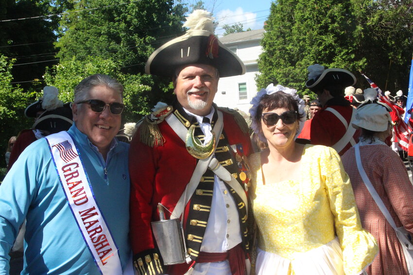 PARADE STALWARTS:  Ron Barnes, who is retiring after serving 20 years as commanding officers of the Pawtuxet Rangers is flanked by Dean Scanlon and Tracey Miller moments before the parade stepped off. Dean who owns and operates the American Revolution Bistro in Pawtuxet served as Parade Grand Marshal Tracey is president of this year’s parade.