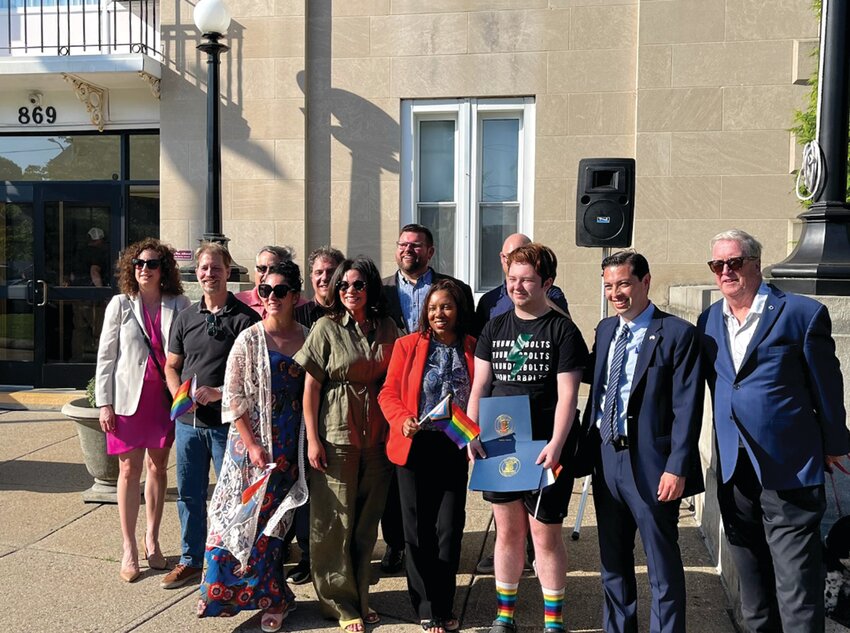 City and state officials gather at Cranston City Hall for the city&rsquo;s annual Pride Flag Raising event organized by Councilwoman Lammis Vargas. The event featured a keynote speech from recent Cranston High School East graduate Connor Payne. (Submitted photo)