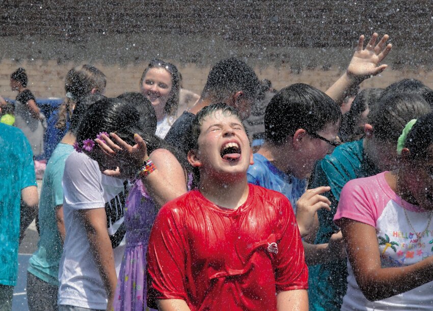 Hoxsie School students got to cool off and revel in the spray provided by the Warwick Fire Department last Thursday.  &ldquo;It&rsquo;s a great way to end the year with an exclamation point,&rdquo; said Principal Gary McCombs.  Story and more photos by Barbara Polichetti on age 8.