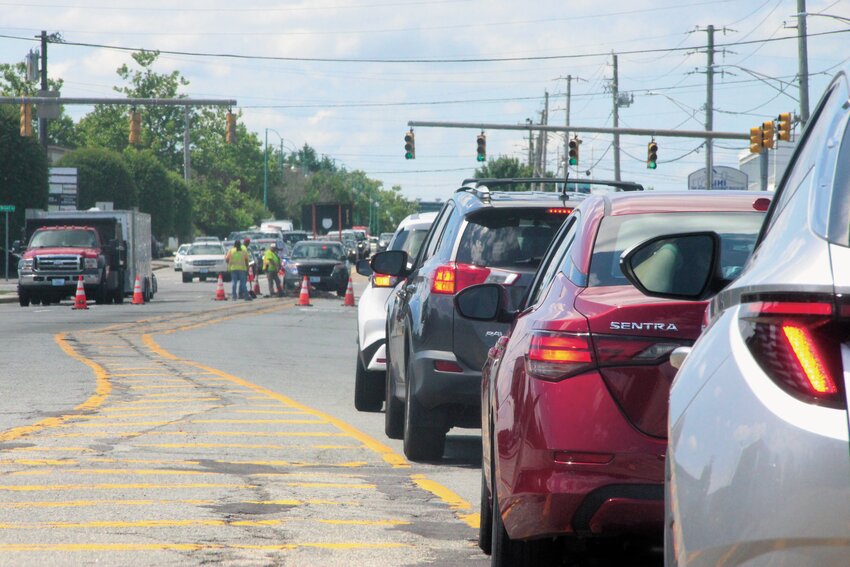MORE OF THIS TO COME: Traffic backed up at the intersection of Post and Airport Roads earlier this week as crews squeezed lanes in preparation for the repaving of Post Road. (Warwick Beacon photo)