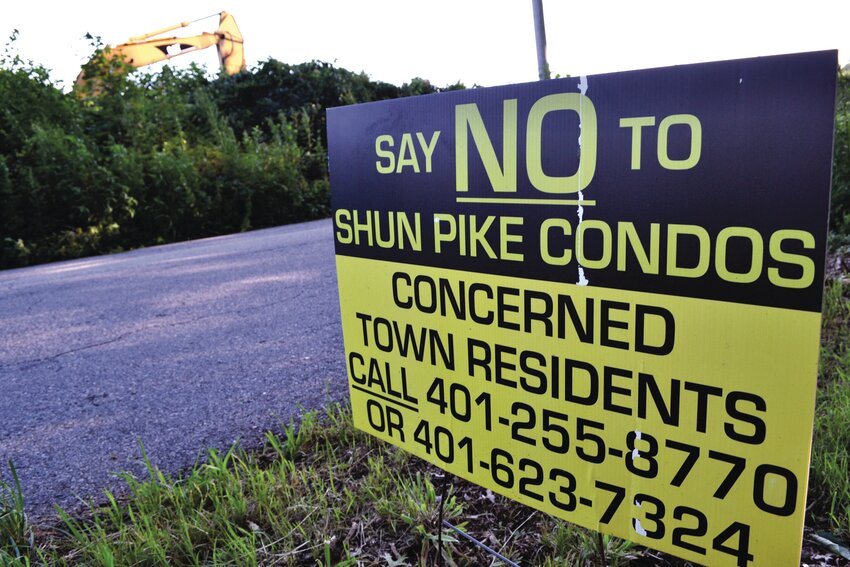SIGNS AGAINST CHANGE: Keri Dennison-Leidecker, who lives at 200 Shun Pike, noted all the yellow signs around the proposed site. “Notably, the signs displayed throughout our entire neighborhood express a collective sentiment against this development,” she told the Johnston Planning Board last week.