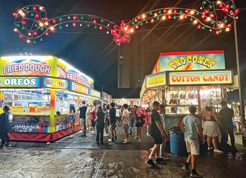 FESTIVE: Food vendors drew long lines at the festival grounds set up around the headquarters of the St. Mary's Feast Society.