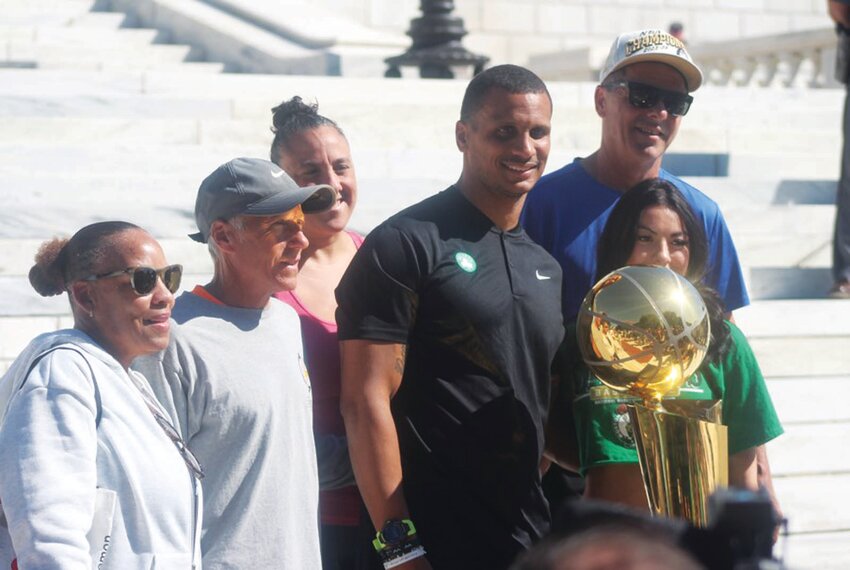 HOMECOMING: Boston Celtics head coach and Johnston native Joe Mazzulla gathers with his family at the state house on Tuesday morning along with the Larry O&rsquo;Brien Trophy (above). Mazzulla is joined by RI Gov. Dan McKee and Celtics owner Steve Pagliuca (at left). (Photos by Alex Sponseller)