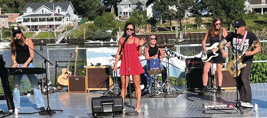 STILL MOVING AROUND: Byron, in red, leads her band, Stillhouse, in a performance.